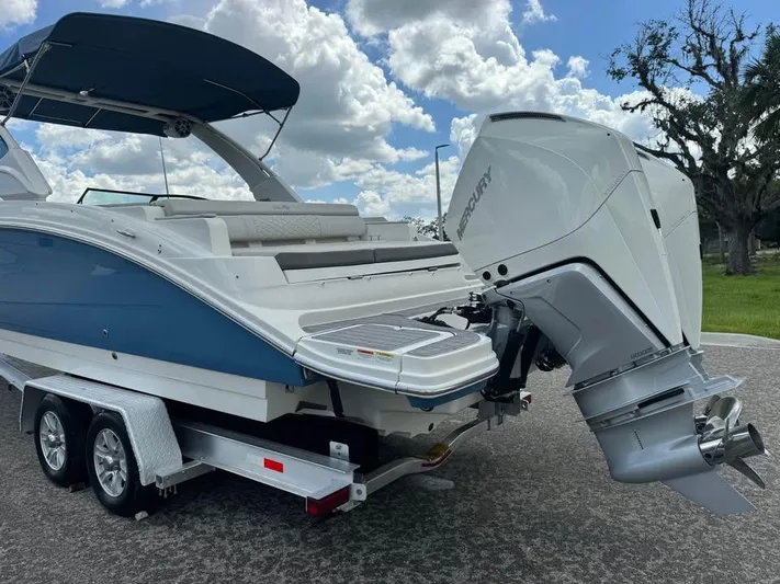 Yacht Photos Pics 2022 Sea Ray SDX 290 Outboard boat on trailer, featuring sleek design and powerful engine.