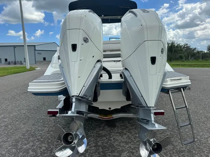  Yacht Photos Pics 2022 Sea Ray SDX 290 Outboard with dual engines, rear view on pavement.