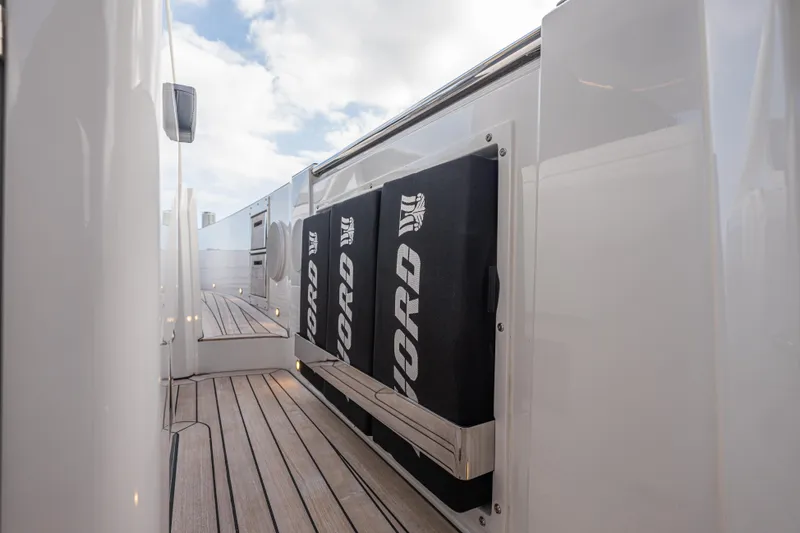 Improper Yacht Photos Pics 2024 Fjord 41 XL yacht deck with sleek design and branded storage compartments.