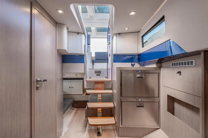 Improper Yacht Photos Pics Luxurious interior of 2024 Fjord 41 XL yacht, featuring modern design and sleek cabinetry.