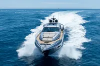 2024 Pershing 7X yacht cruising on open sea, leaving a white wake trail.