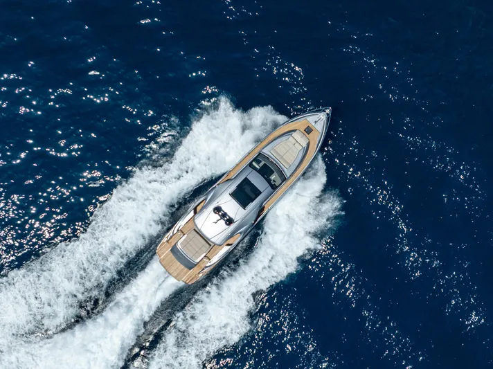 Ciao Yacht Photos Pics Aerial view of 2024 Pershing 7X yacht cruising on open blue sea.