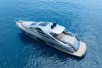 2024 Pershing 7X yacht cruising on clear blue ocean waters.