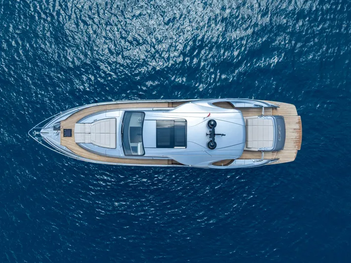 Ciao Yacht Photos Pics Top view of 2024 Pershing 7X yacht on blue ocean water.