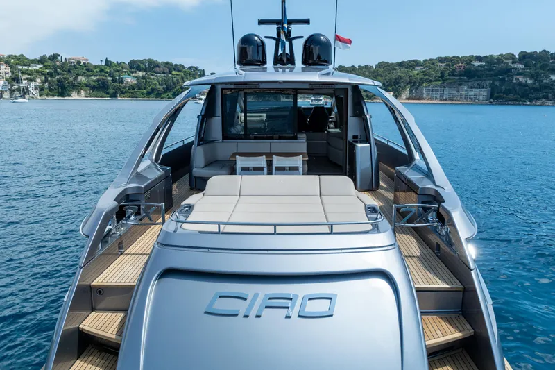 Ciao Yacht Photos Pics 2024 Pershing 7X luxury yacht on serene water, showcasing sleek design and spacious deck.