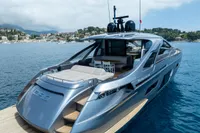 2024 Pershing 7X luxury yacht on serene blue waters, showcasing sleek design and modern amenities.