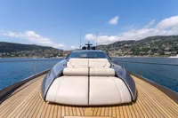2024 Pershing 7X yacht with sleek design on open water, scenic coastal backdrop.