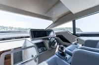 Interior of 2024 Pershing 7X yacht cockpit with modern controls and panoramic view.