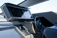 2024 Pershing 7X yacht helm with modern dashboard and steering wheel.