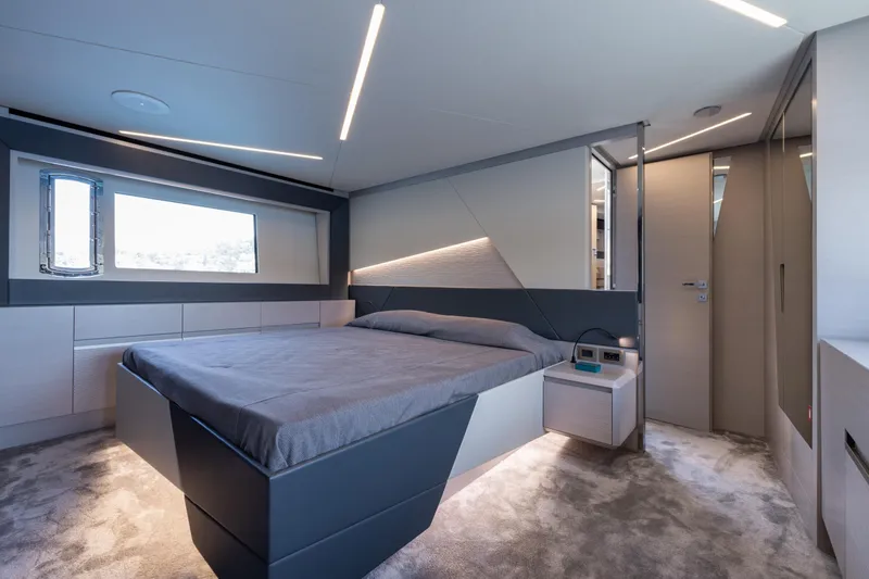 Ciao Yacht Photos Pics Luxurious bedroom interior of 2024 Pershing 7X yacht with modern design and ambient lighting.