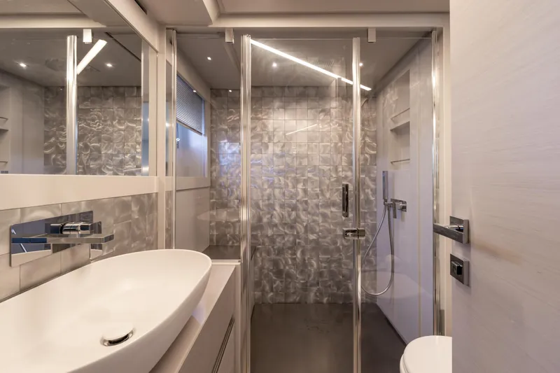 Ciao Yacht Photos Pics Luxurious bathroom interior of 2024 Pershing 7X yacht with modern fixtures and elegant design.