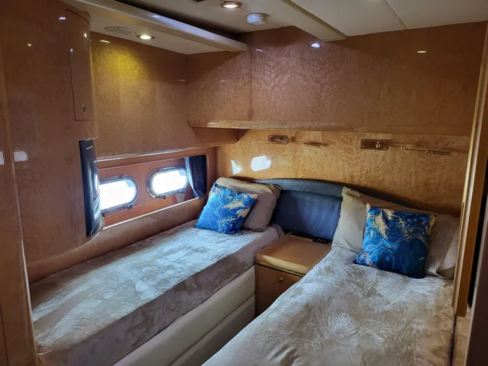  Yacht Photos Pics Luxurious cabin interior of 2000 Horizon 74 Motor Yacht with twin beds and elegant decor.