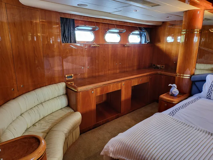  Yacht Photos Pics Luxurious interior of 2000 Horizon 74 Motor Yacht with wood paneling and plush seating.