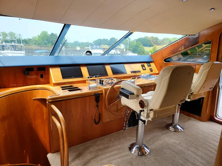  Yacht Photos Pics Helm of 2000 Horizon 74 Motor Yacht with dual seats and panoramic windows.