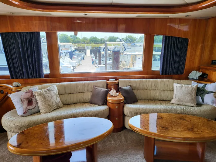  Yacht Photos Pics Luxurious interior of 2000 Horizon 74 Motor Yacht with plush seating and elegant wood finishes.