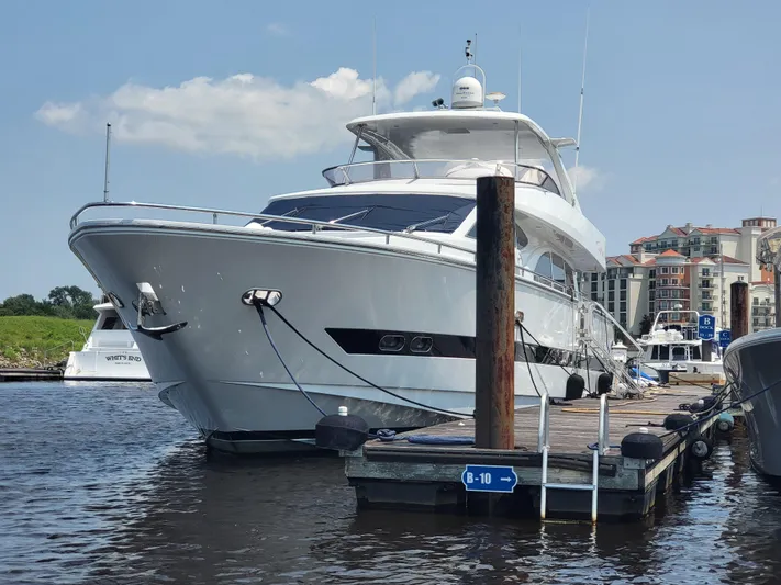  Yacht Photos Pics Horizon 74 Motor Yacht 2000 docked at marina, clear sky, waterfront buildings.