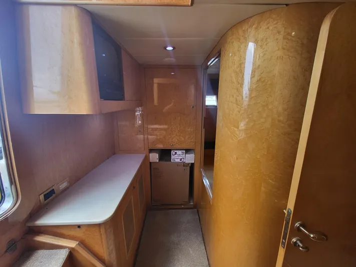  Yacht Photos Pics Interior of 2000 Horizon 74 Motor Yacht with wood paneling and cabinetry.