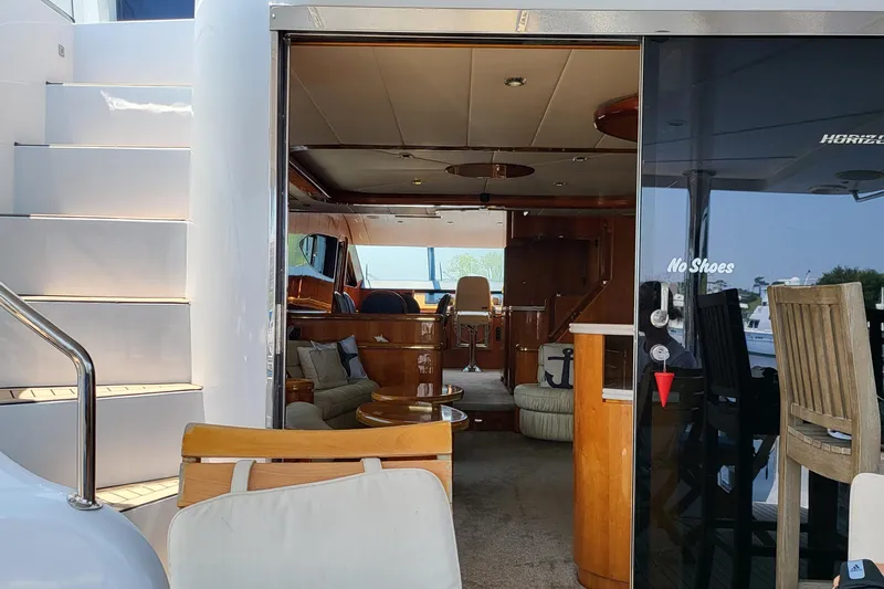  Yacht Photos Pics Interior view of 2000 Horizon 74 Motor Yacht with elegant wooden furnishings.