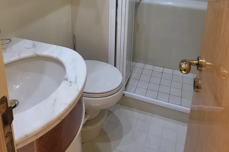  Yacht Photos Pics Bathroom in 2000 Horizon 74 Motor Yacht with marble sink and shower.