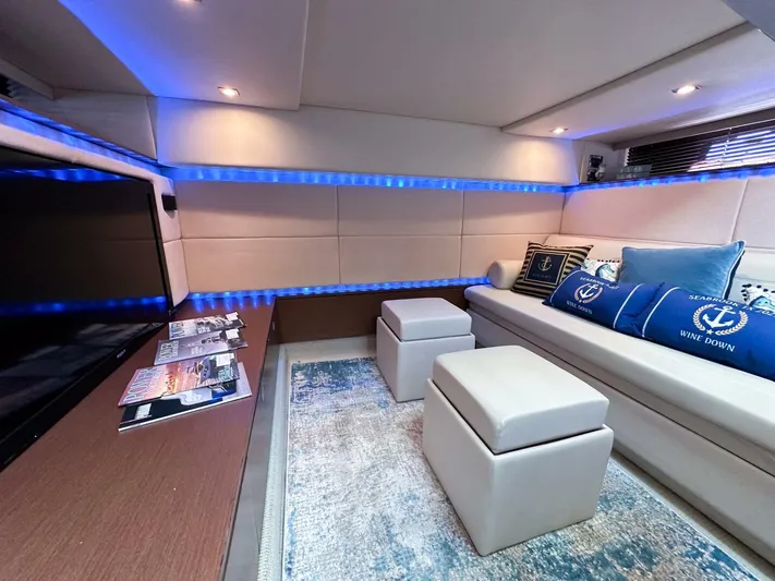 Wine Down Yacht Photos Pics Luxurious interior of 2012 Sea Ray 450 Sundancer yacht with modern seating and ambient lighting.