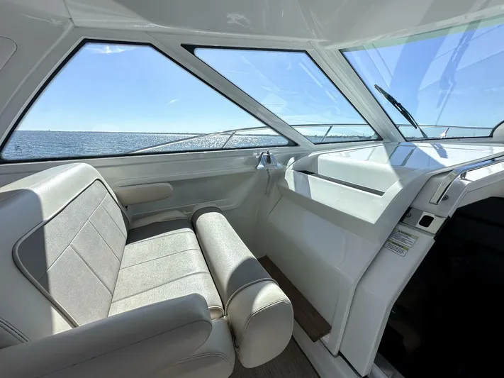 Wine Down Yacht Photos Pics Interior of 2012 Sea Ray 450 Sundancer yacht with ocean view through windows.