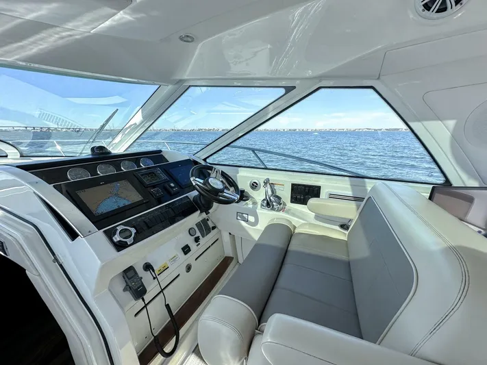 Wine Down Yacht Photos Pics Interior of 2012 Sea Ray 450 Sundancer yacht with modern helm and ocean view.