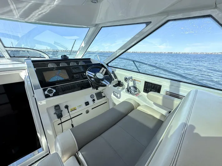 Wine Down Yacht Photos Pics 2012 Sea Ray 450 Sundancer helm with modern controls and ocean view.