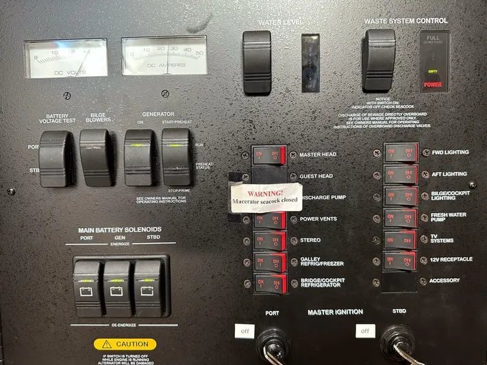 Wine Down Yacht Photos Pics Control panel of a 2012 Sea Ray 450 Sundancer boat with various switches and gauges.
