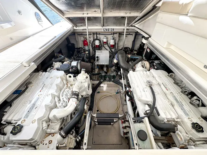 Wine Down Yacht Photos Pics Engine room of 2012 Sea Ray 450 Sundancer yacht, showcasing dual engines and mechanical components.