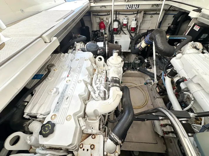 Wine Down Yacht Photos Pics Engine room of a 2012 Sea Ray 450 Sundancer, showcasing dual engines and mechanical components.