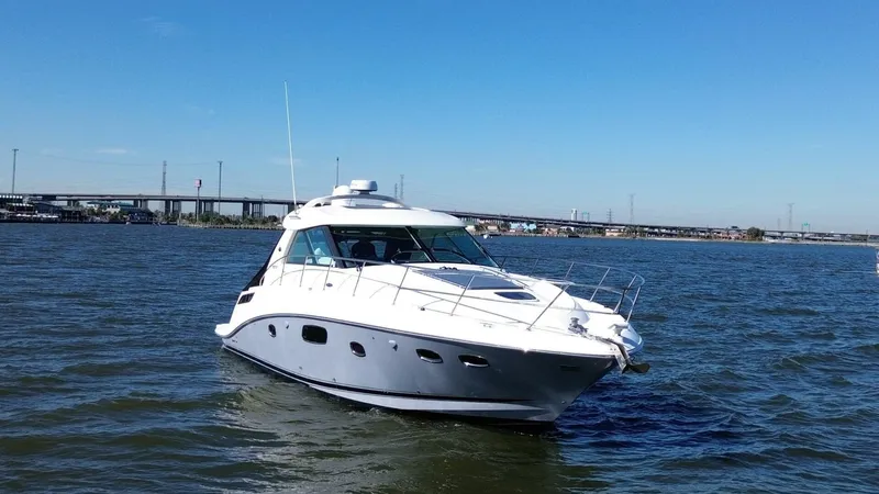 Wine Down Yacht Photos Pics 2012 Sea Ray 450 Sundancer yacht cruising on open water.