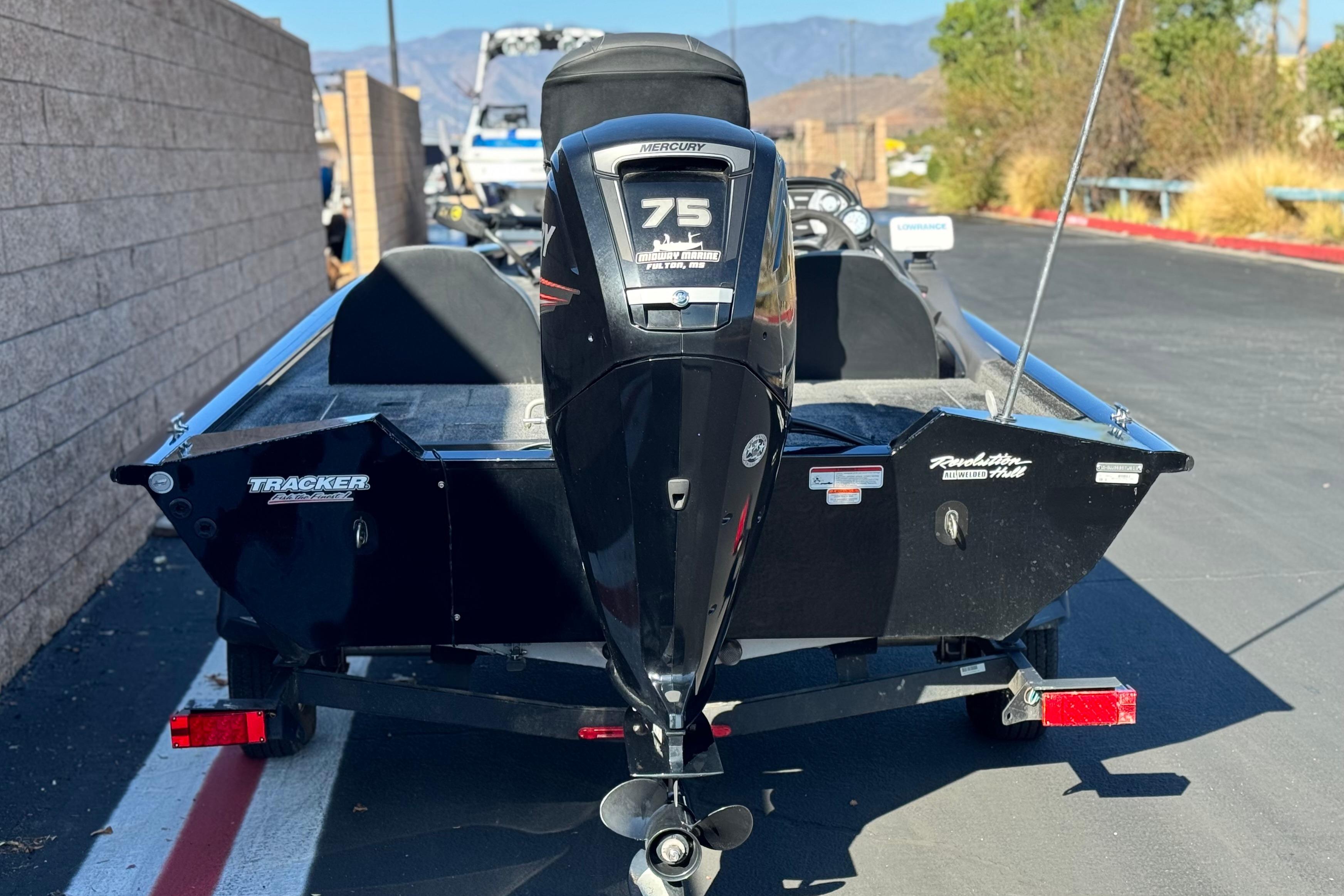2019 Tracker Pro Team 175 boat with Mercury 75 engine, parked outdoors.