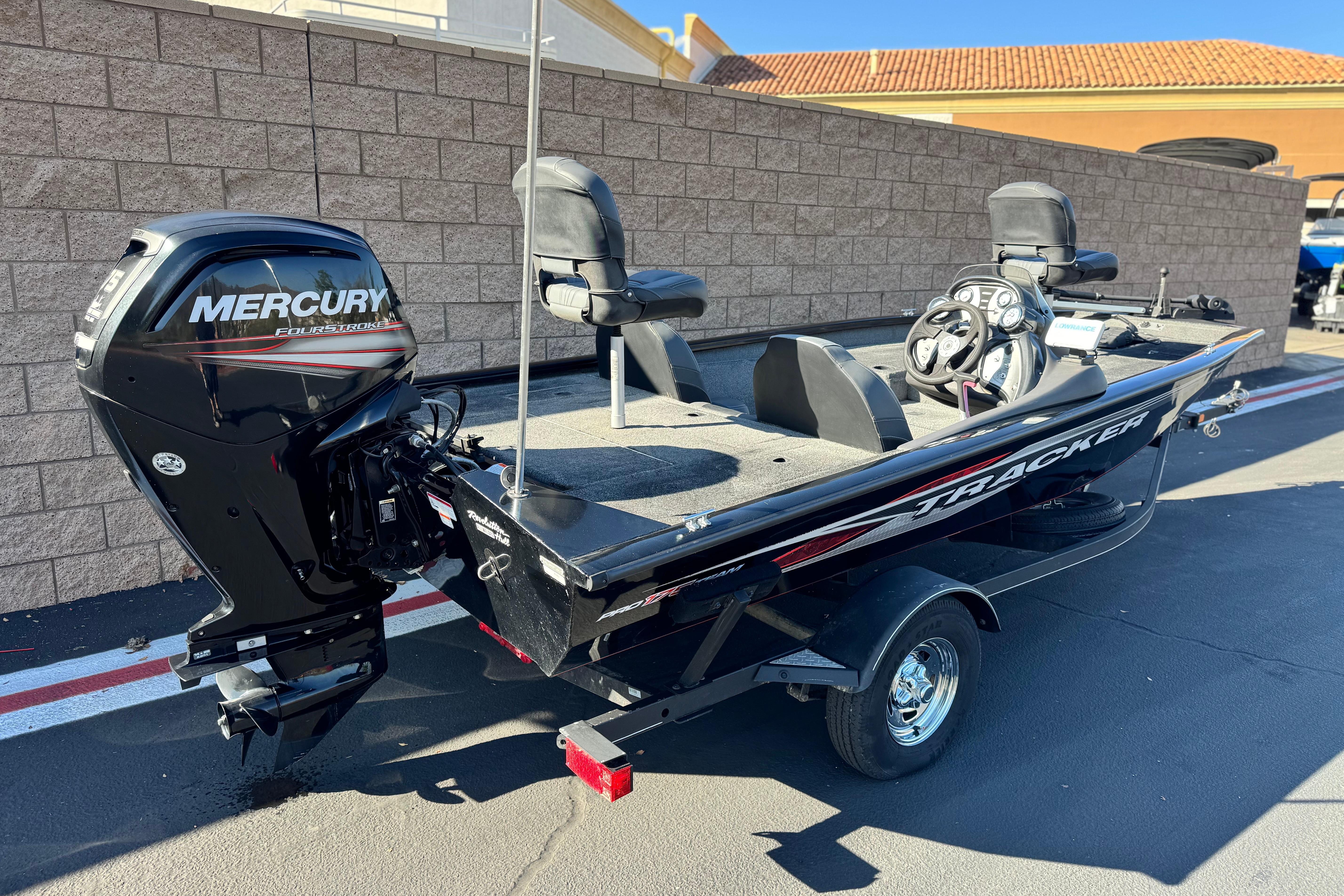 2019 Tracker Pro Team 175 boat with Mercury engine, parked outdoors.