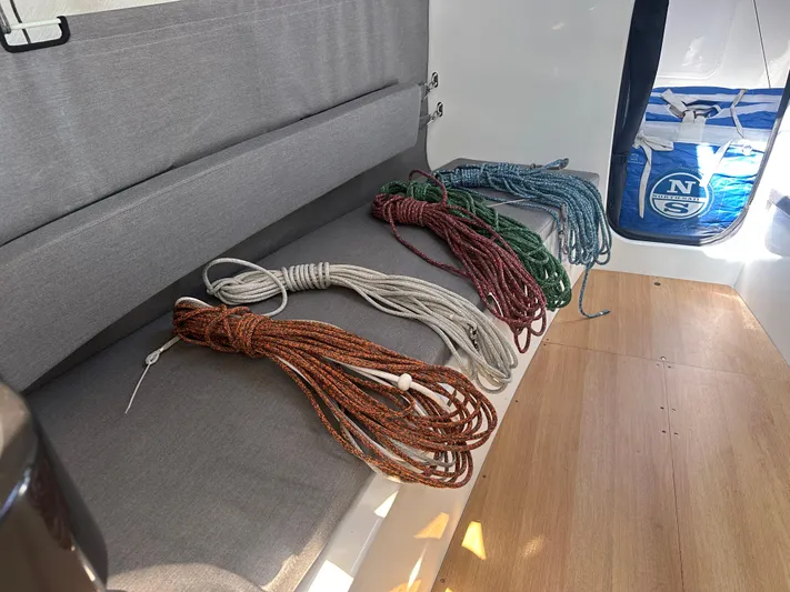 Rebel Yacht Photos Pics Coiled ropes on Jeanneau Sun Fast 3300 sailboat interior, 2021 model.