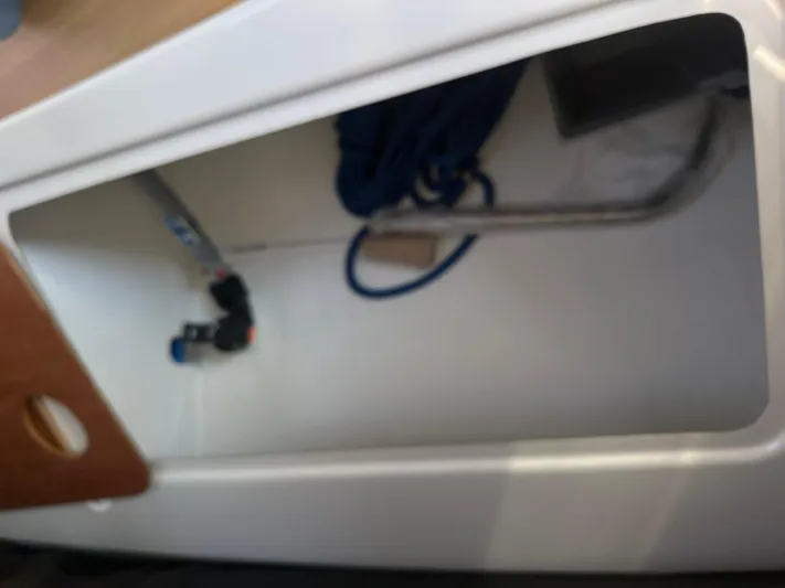 Rebel Yacht Photos Pics Interior storage compartment of 2021 Jeanneau Sun Fast 3300 sailboat.