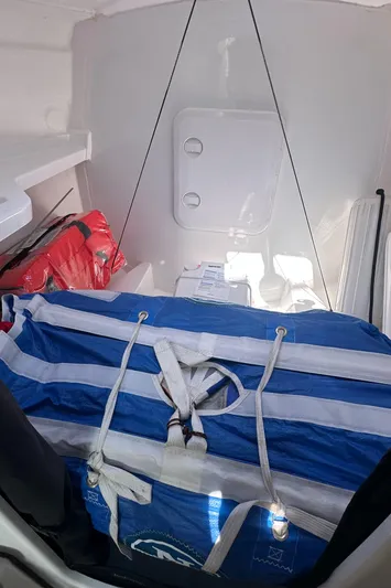 Rebel Yacht Photos Pics Interior of 2021 Jeanneau Sun Fast 3300 sailboat with striped bag and safety equipment.