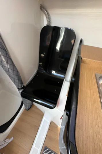 Rebel Yacht Photos Pics Interior of 2021 Jeanneau Sun Fast 3300 sailboat, featuring sleek black seating.