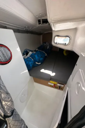Rebel Yacht Photos Pics Interior of 2021 Jeanneau Sun Fast 3300 sailboat, featuring compact sleeping quarters.