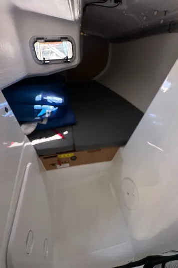 Rebel Yacht Photos Pics 2021 Jeanneau Sun Fast 3300 cabin interior with compact sleeping area.