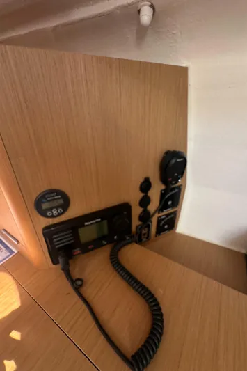 Rebel Yacht Photos Pics Control panel inside 2021 Jeanneau Sun Fast 3300 yacht, featuring communication equipment.