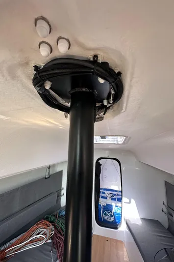 Rebel Yacht Photos Pics Interior view of 2021 Jeanneau Sun Fast 3300 sailboat, showing mast and cabin details.