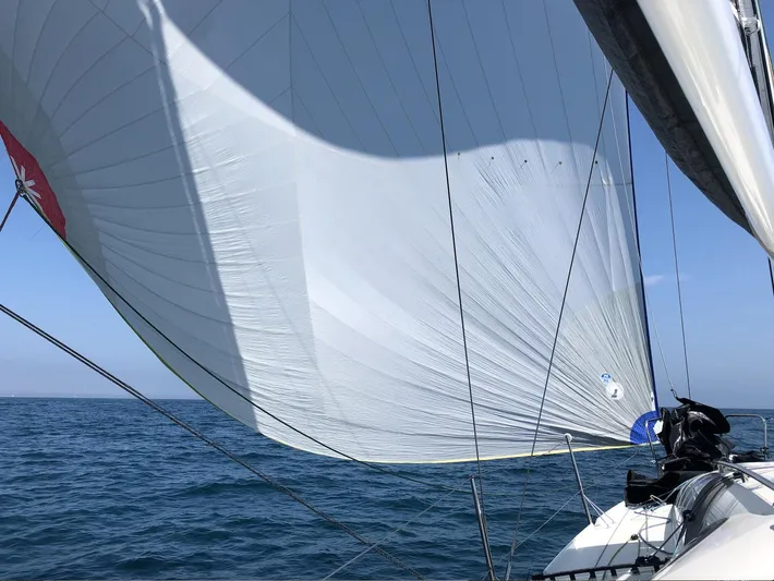 Rebel Yacht Photos Pics 2021 Jeanneau SUNFAST 3300 sailing with full sails on open water.