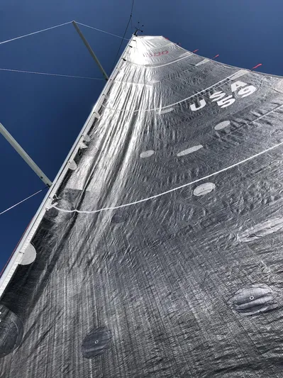 Rebel Yacht Photos Pics Sail of 2021 Jeanneau SUNFAST 3300 against clear blue sky.