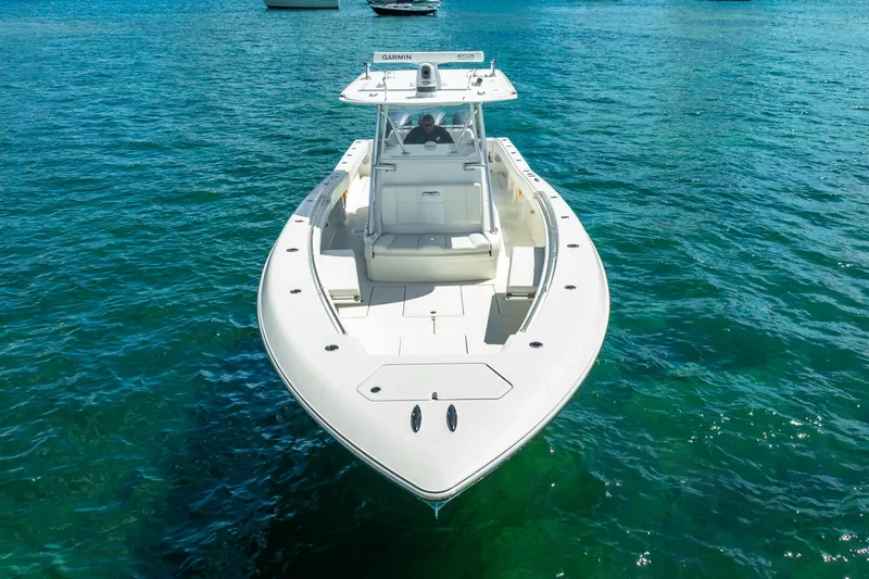  Yacht Photos Pics 2016 Invincible 39 boat on clear blue water, viewed from the front.
