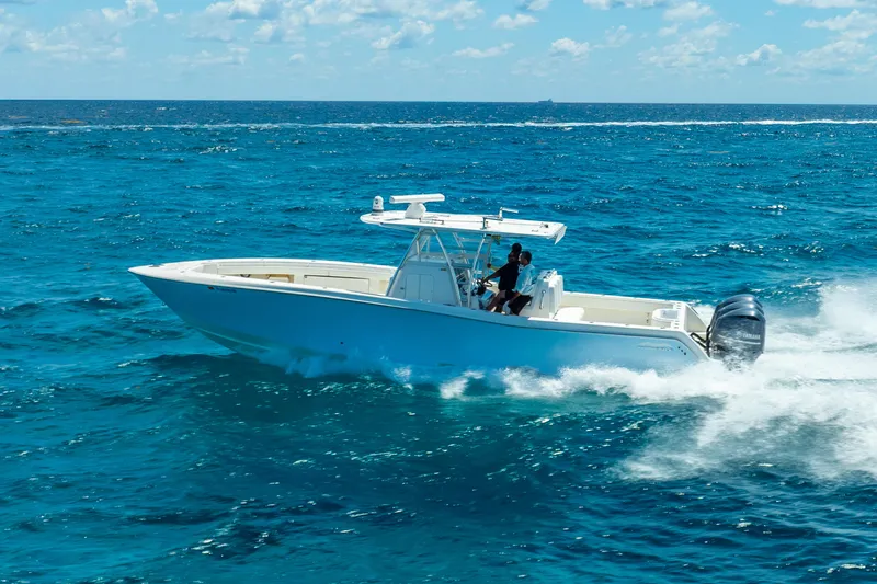  Yacht Photos Pics 2016 Invincible 39 boat cruising on open blue ocean under clear sky.