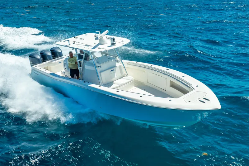  Yacht Photos Pics 2016 Invincible 39 boat cruising on open blue water.