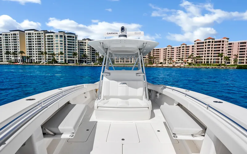  Yacht Photos Pics 2016 Invincible 39 boat on water with cityscape background.