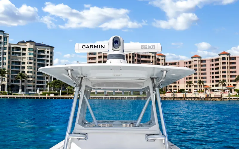  Yacht Photos Pics Invincible 39 boat with Garmin radar, 2016 model, docked near waterfront buildings.