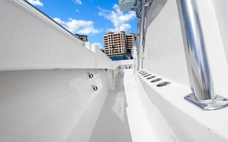  Yacht Photos Pics Invincible 39 boat interior, 2016 model, with sleek white design and cityscape background.