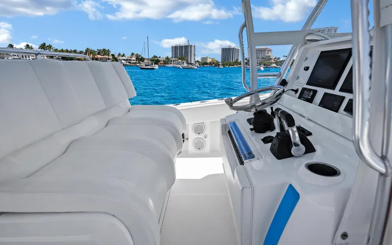  Yacht Photos Pics Interior view of 2016 Invincible 39 boat with modern controls and seating.